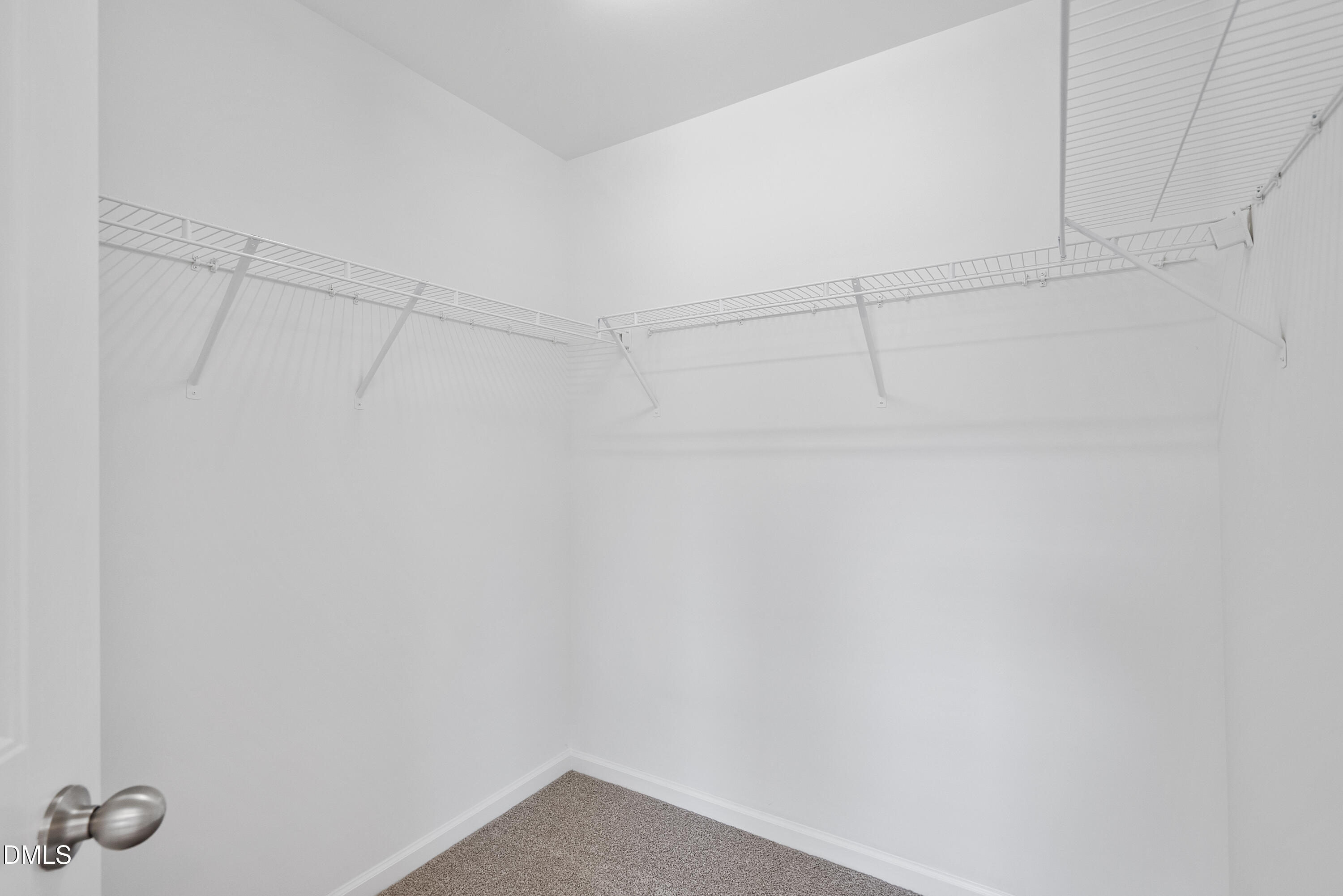 309 Leighann Ridge Lane Rolesville, NC 27571 - Photo 14 of 25 a view of a room with racks on the wall