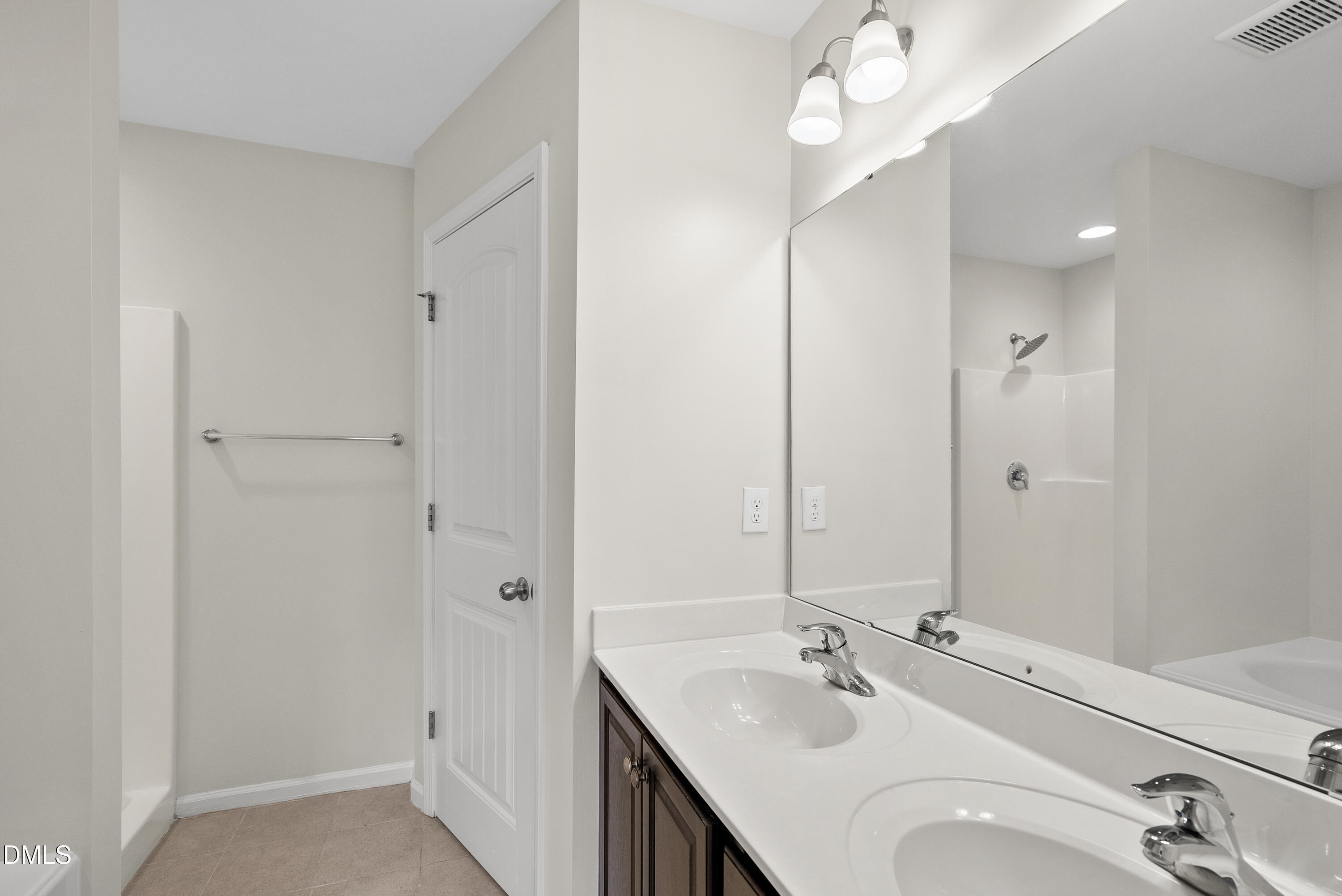 309 Leighann Ridge Lane Rolesville, NC 27571 - Photo 16 of 25 a bathroom with a sink vanity and a mirror