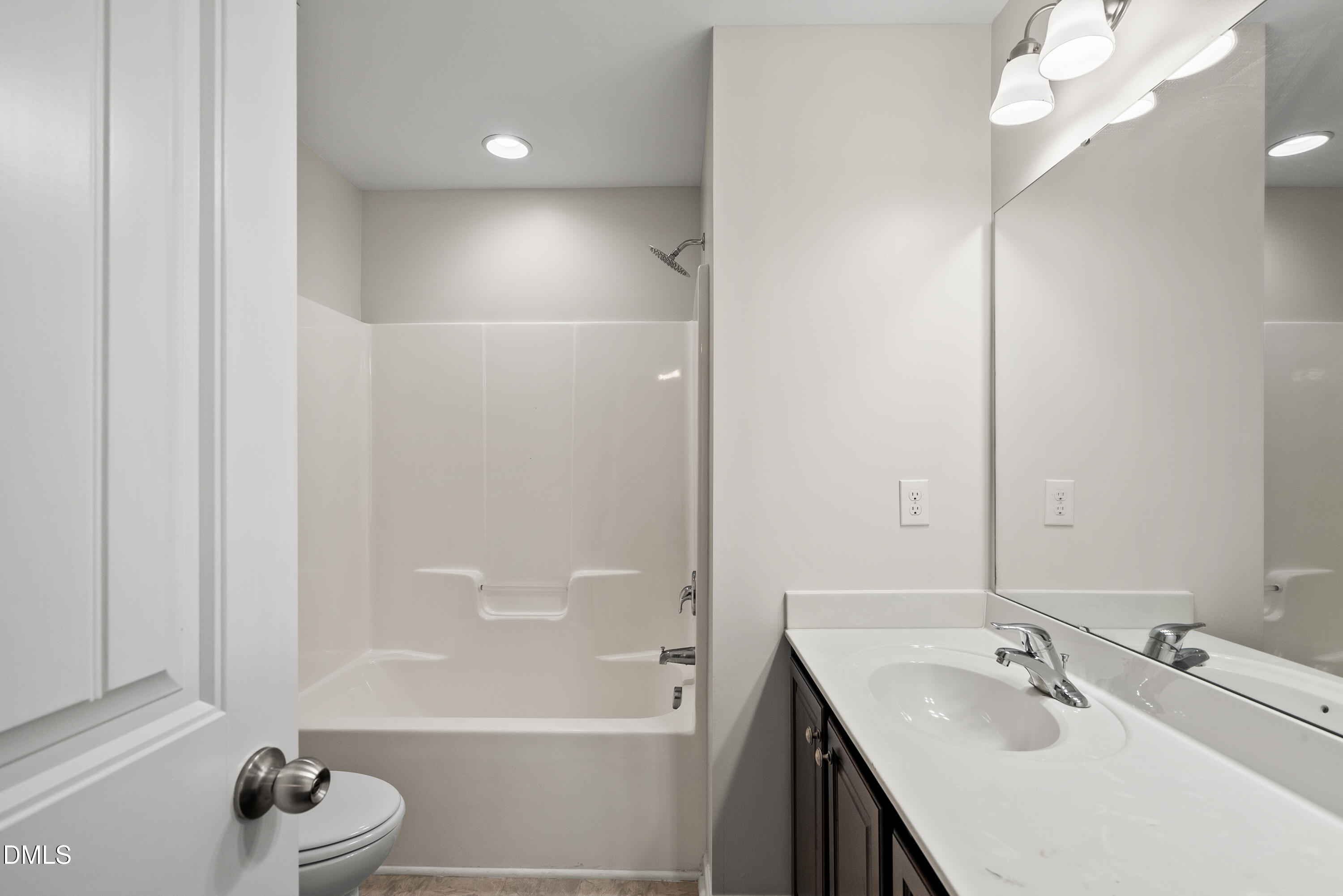 309 Leighann Ridge Lane Rolesville, NC 27571 - Photo 20 of 25 a bathroom with a bathtub a sink and a mirror