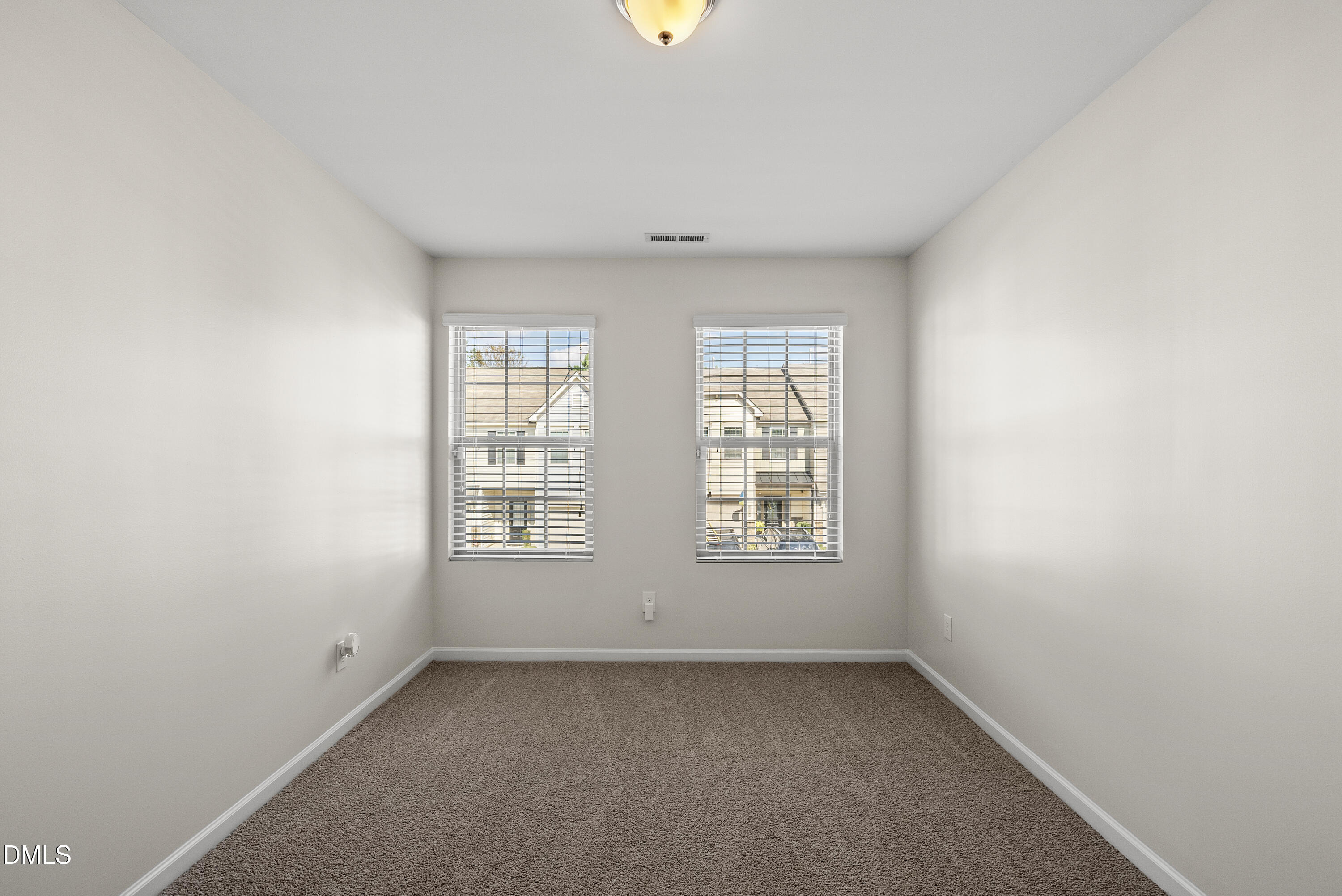 309 Leighann Ridge Lane Rolesville, NC 27571 - Photo 21 of 25 an empty room with windows