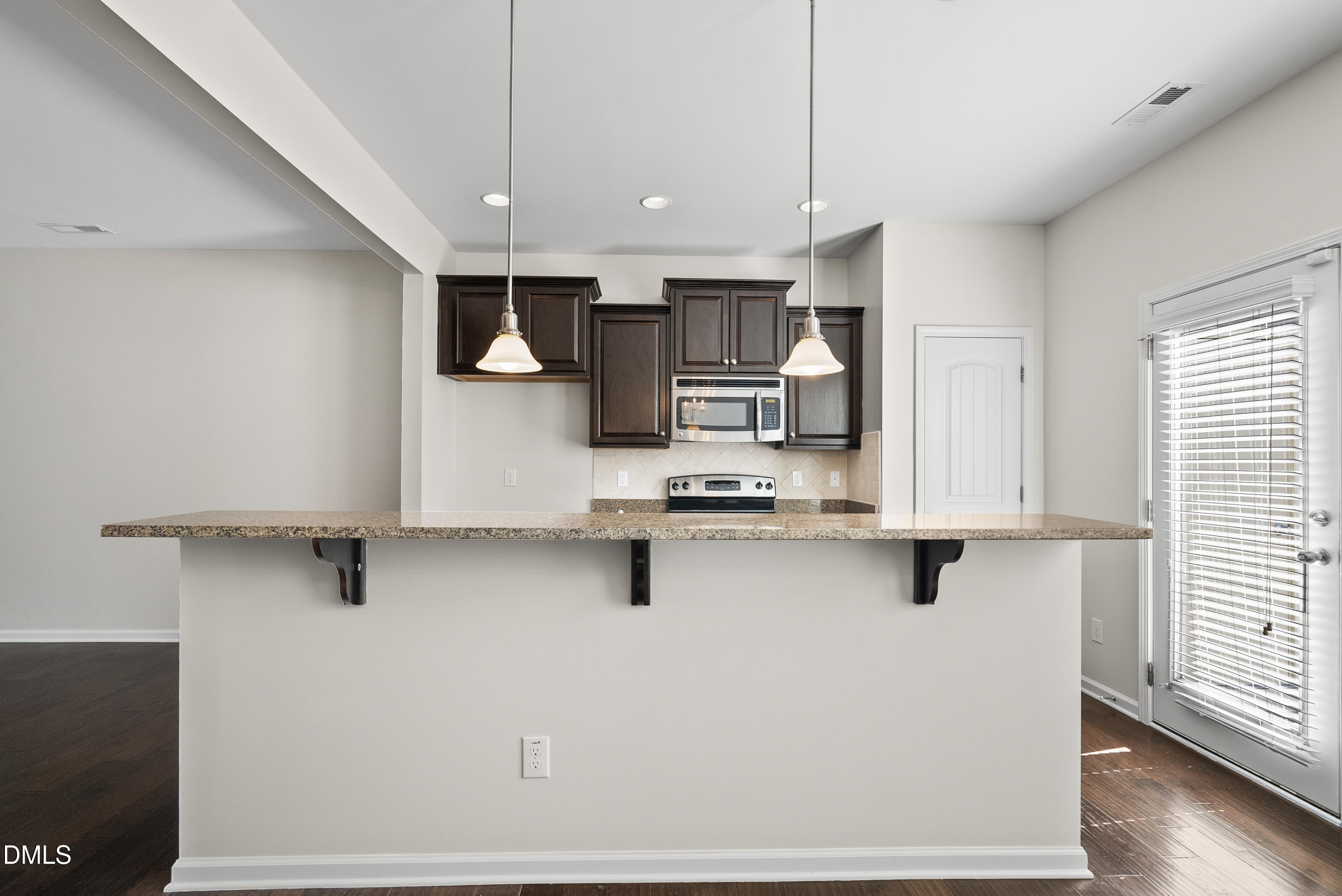 309 Leighann Ridge Lane Rolesville, NC 27571 - Photo 4 of 25 a kitchen with stainless steel appliances a refrigerator sink and microwave