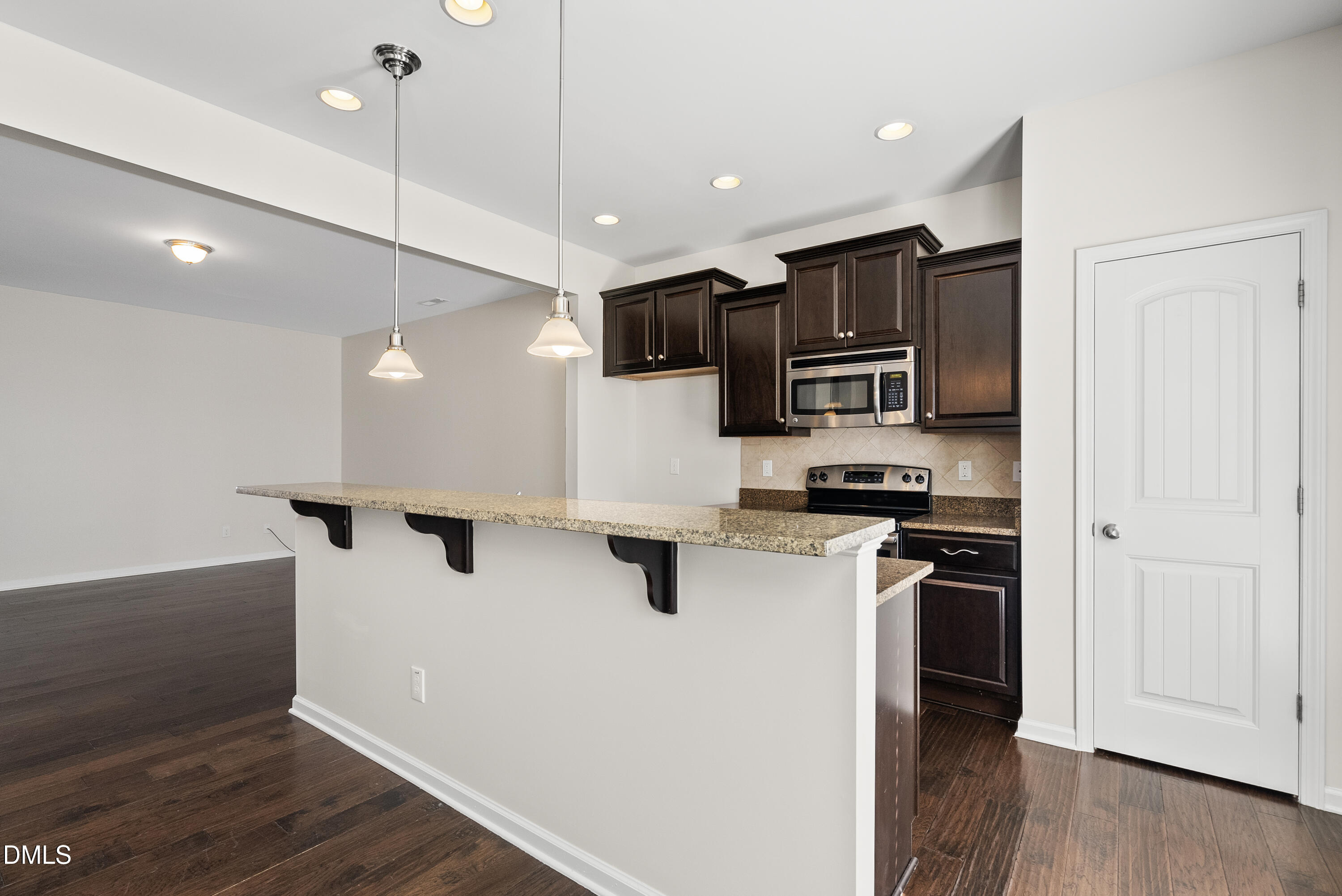 309 Leighann Ridge Lane Rolesville, NC 27571 - Photo 5 of 25 a kitchen with stainless steel appliances a refrigerator sink and microwave