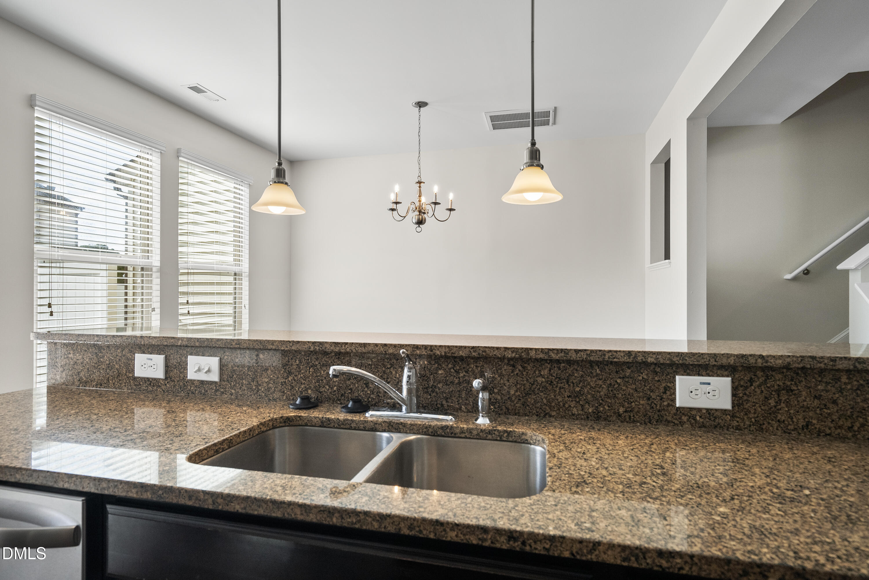 309 Leighann Ridge Lane Rolesville, NC 27571 - Photo 8 of 25 a kitchen with a sink and chandelier