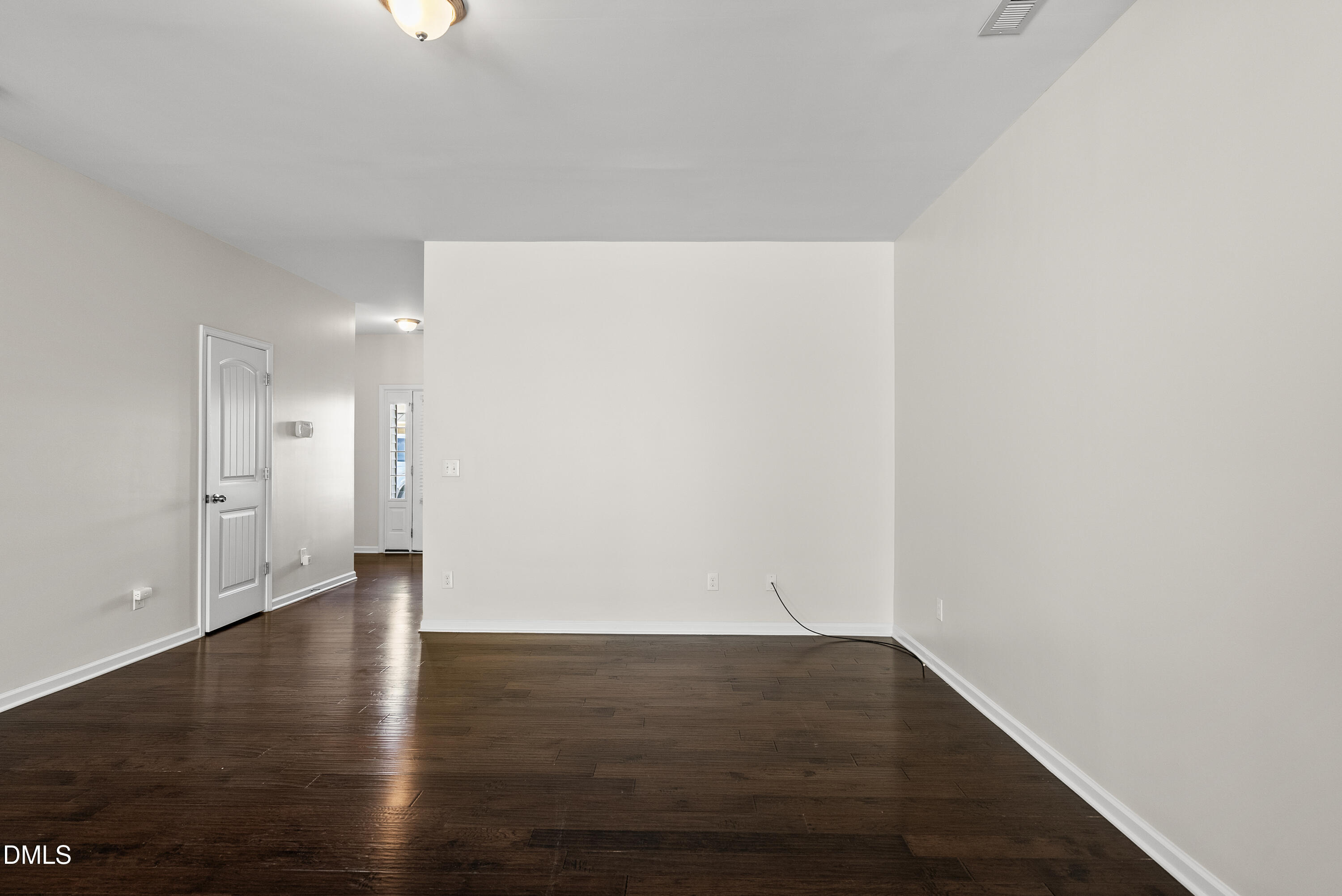 309 Leighann Ridge Lane Rolesville, NC 27571 - Photo 9 of 25 a view of an empty room with wooden floor