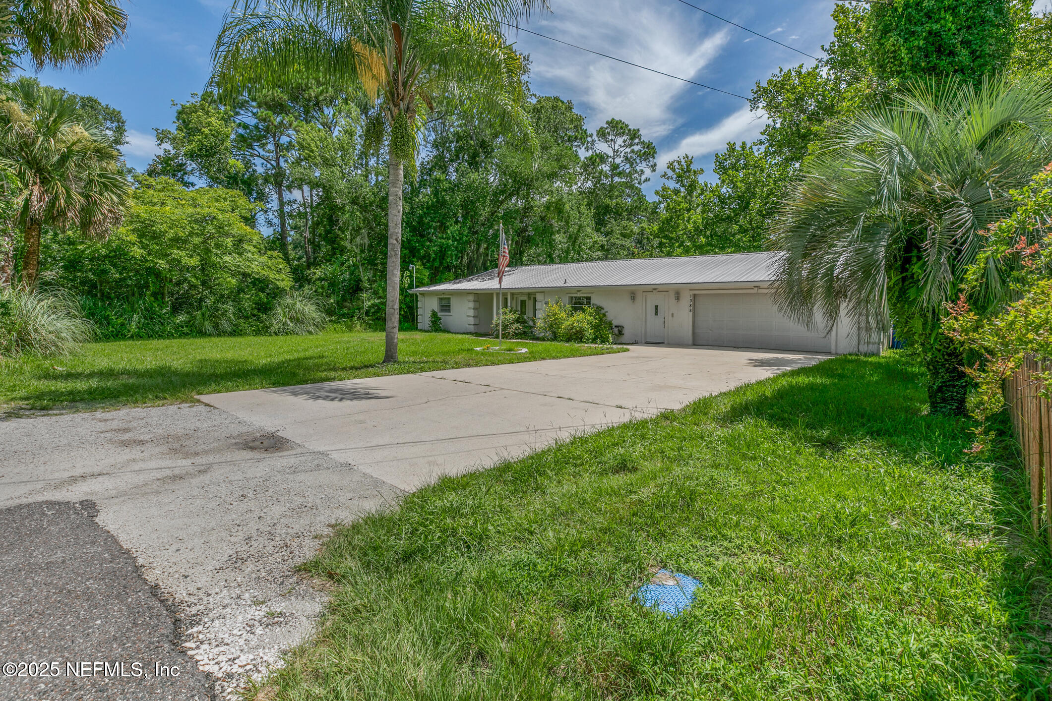 1388 Highland Boulevard St. Augustine, FL 32084 - Photo 2 of 54 a view of a yard with a street