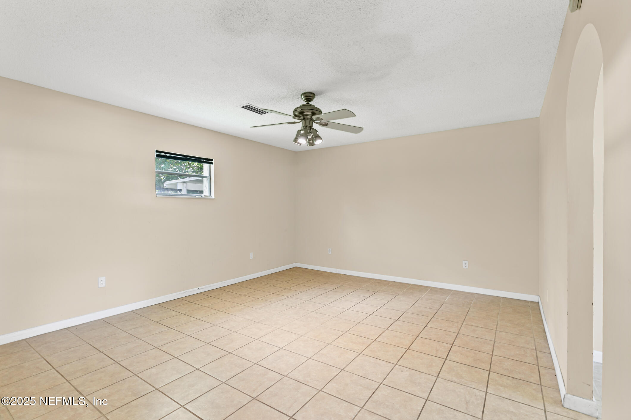1388 Highland Boulevard St. Augustine, FL 32084 - Photo 23 of 54 wooden floor in an empty room with a window