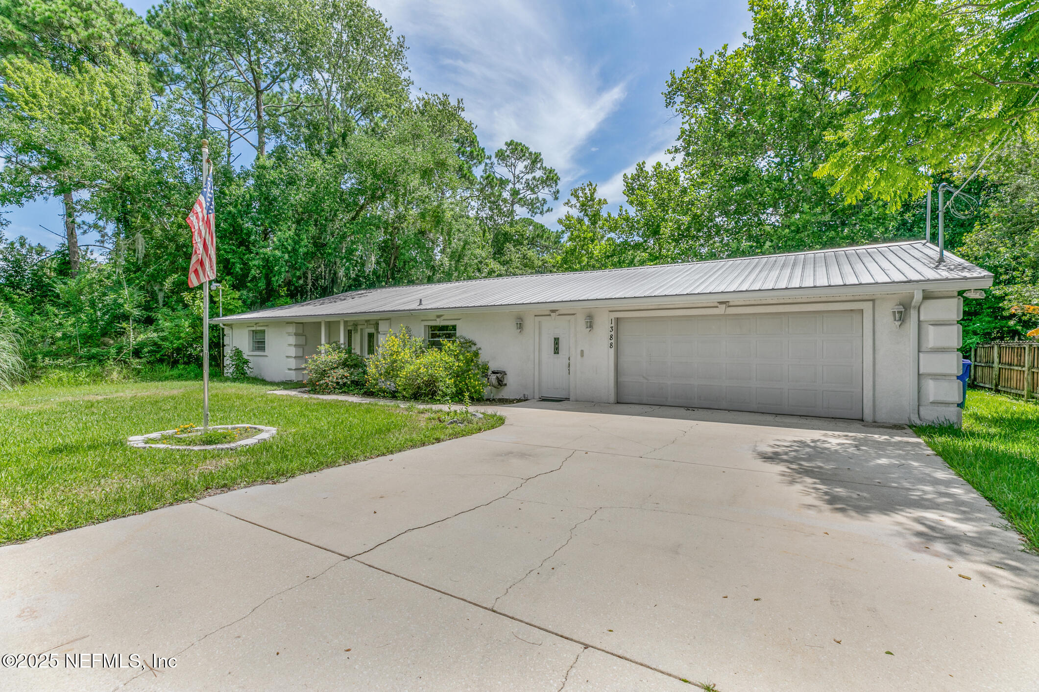 1388 Highland Boulevard St. Augustine, FL 32084 - Photo 5 of 54 a view front of house with a yard and potted plants