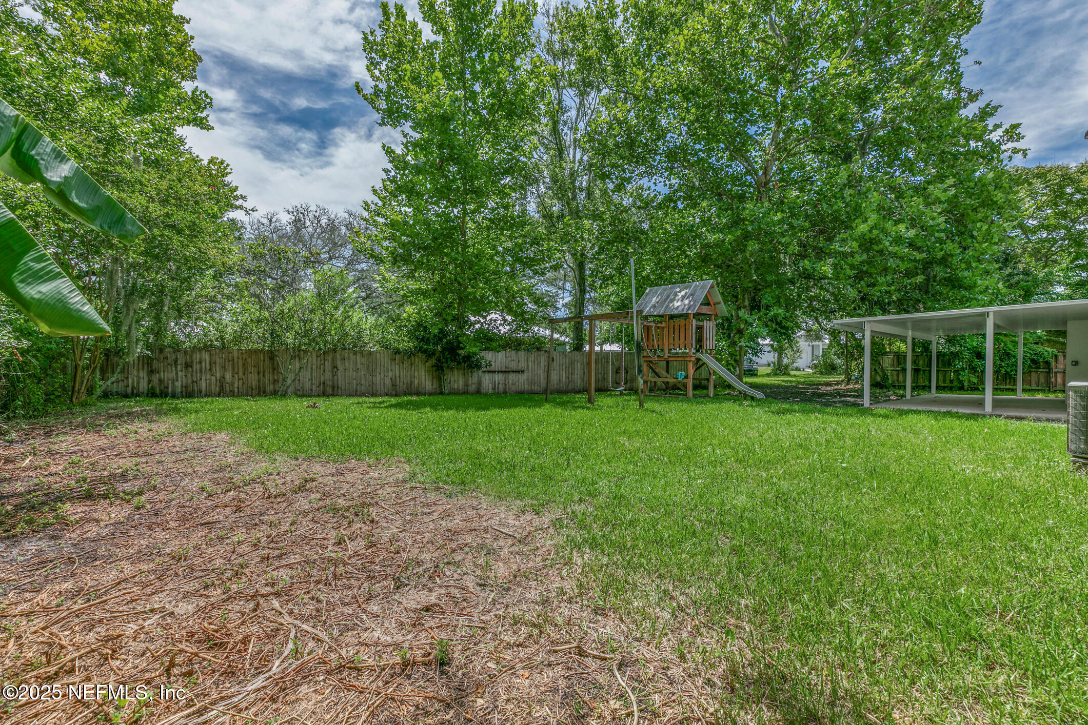 1388 Highland Boulevard St. Augustine, FL 32084 - Photo 53 of 54 a view of a house with a backyard