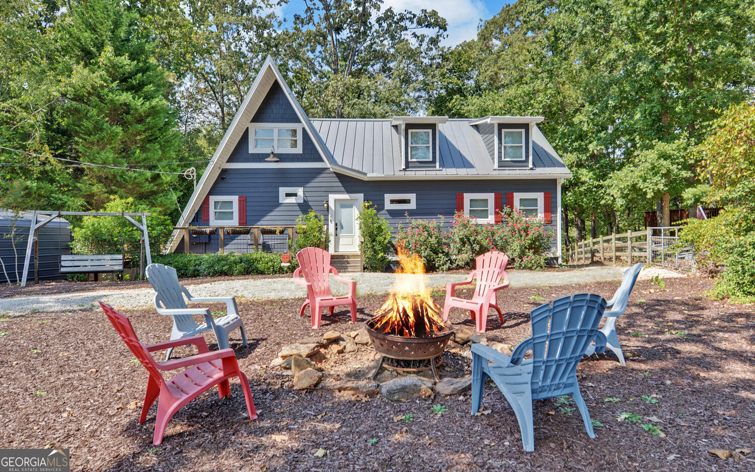 a view of a house with backyard sitting area and garden