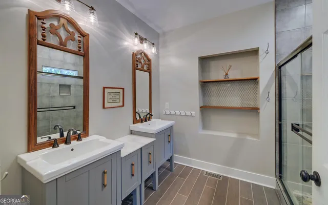 a bathroom with a sink toilet and shower