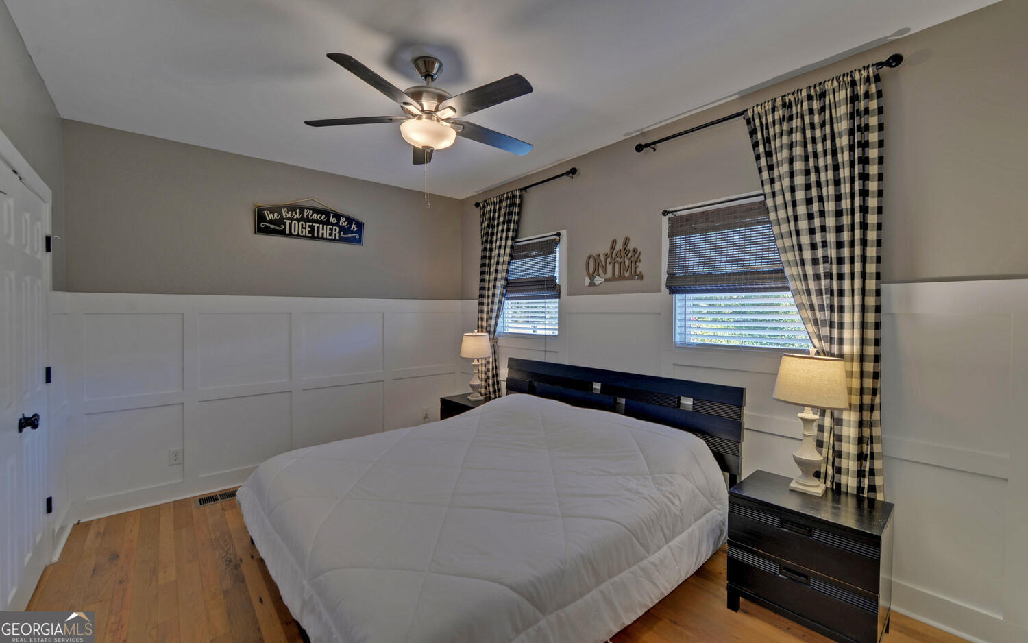 1047 Tranquility Lane Hartwell, GA 30643 - Photo 20 of 60 a bedroom with a bed and a chandelier