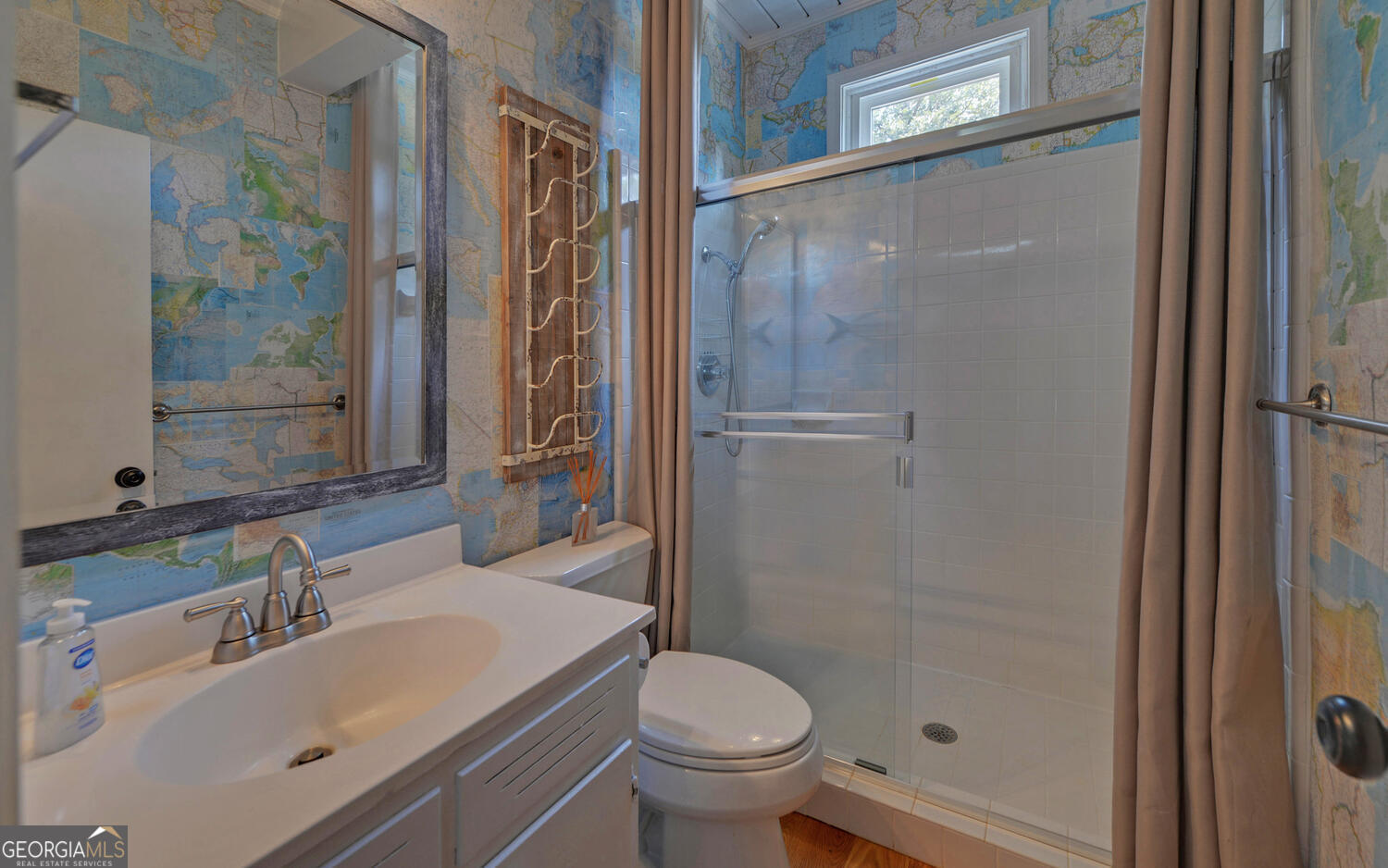 1047 Tranquility Lane Hartwell, GA 30643 - Photo 23 of 60 a bathroom with a sink toilet and shower