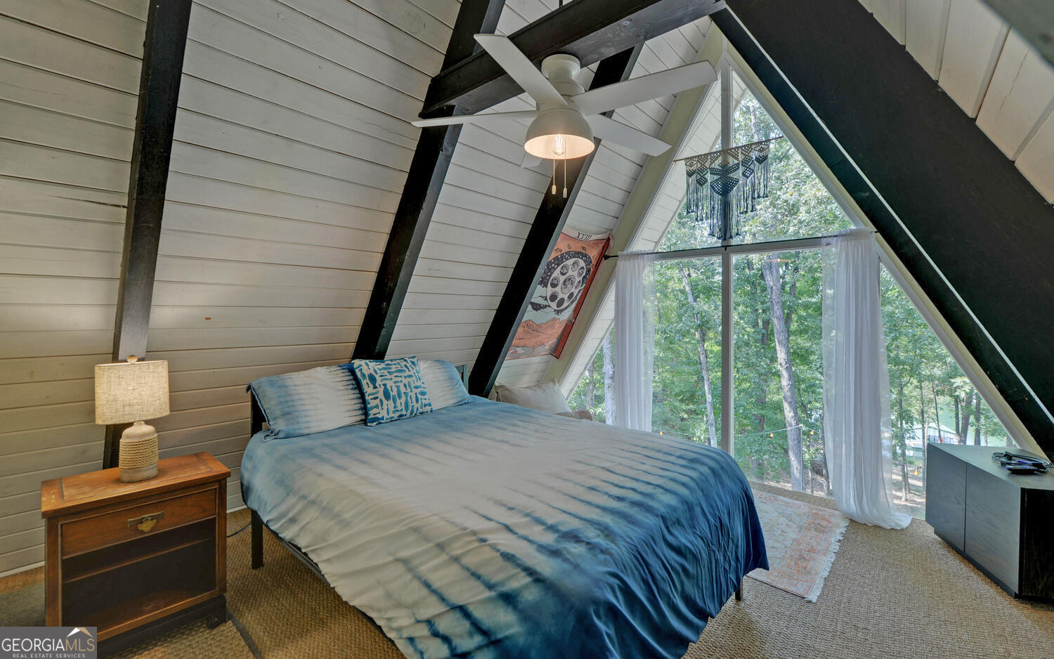 1047 Tranquility Lane Hartwell, GA 30643 - Photo 28 of 60 a bedroom with a bed and a large window