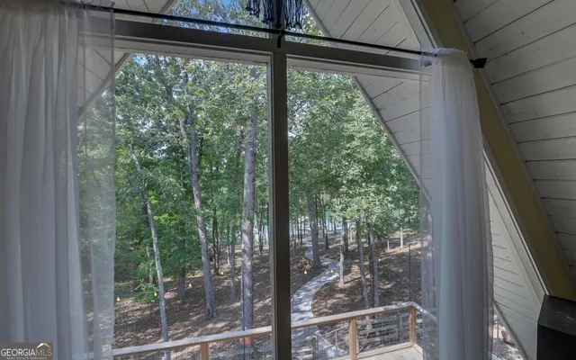 a view of a two chairs and table in the balcony