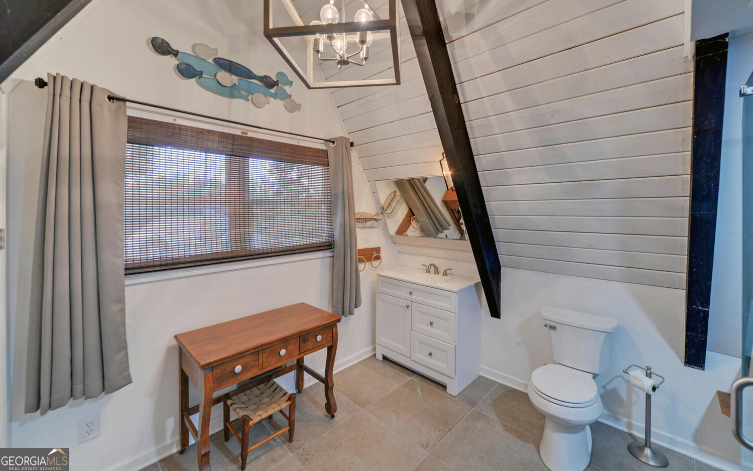 1047 Tranquility Lane Hartwell, GA 30643 - Photo 32 of 60 a bathroom with a toilet a sink and a mirror