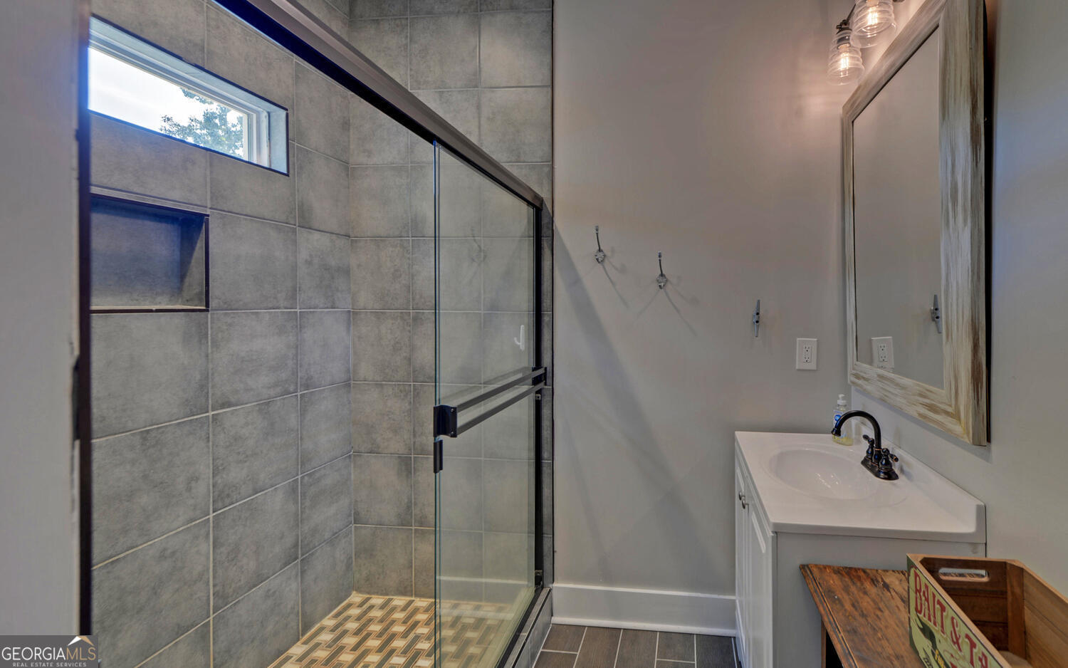 1047 Tranquility Lane Hartwell, GA 30643 - Photo 33 of 60 a bathroom with a sink and shower