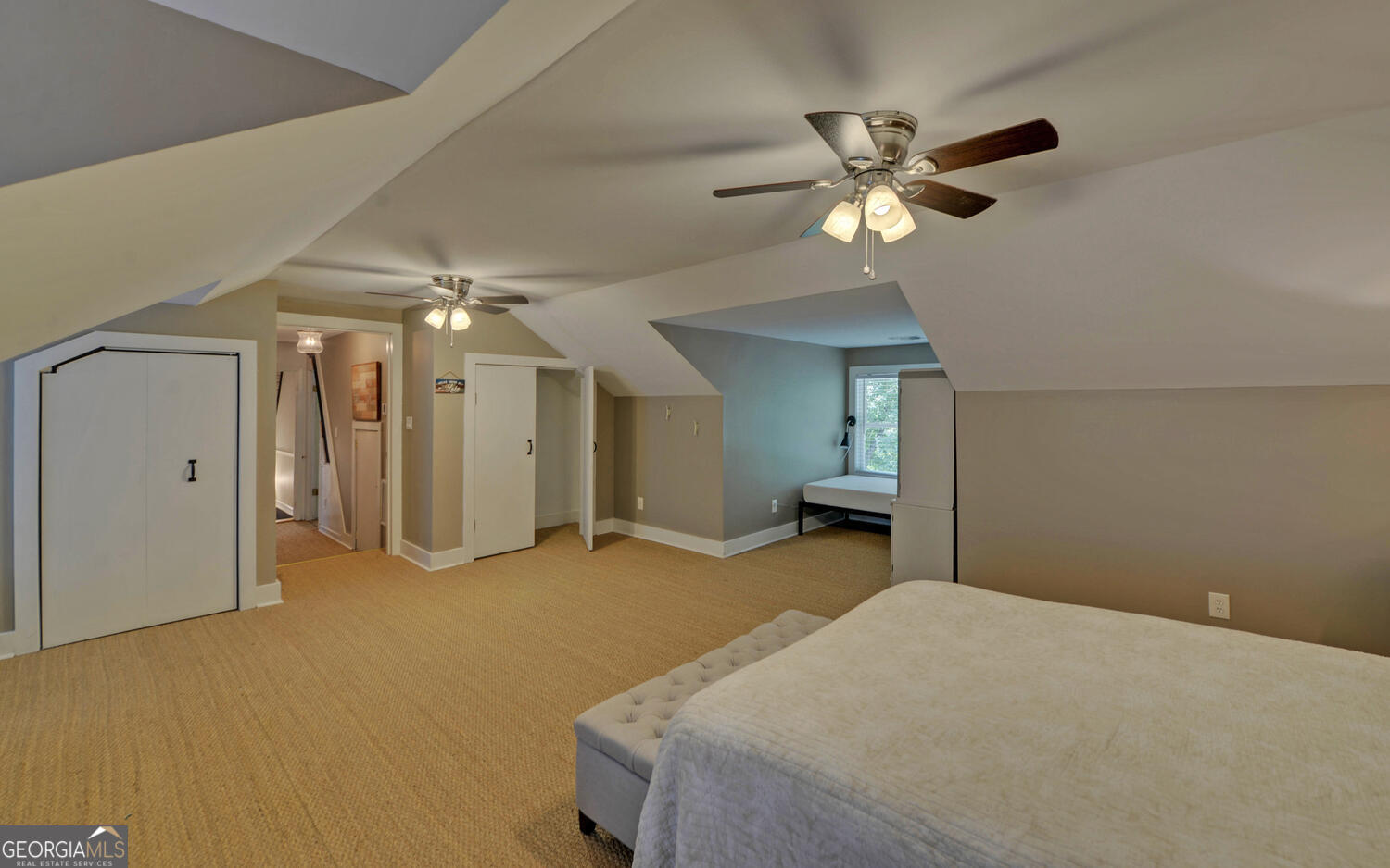 1047 Tranquility Lane Hartwell, GA 30643 - Photo 36 of 60 a bedroom with a bed and a chandelier