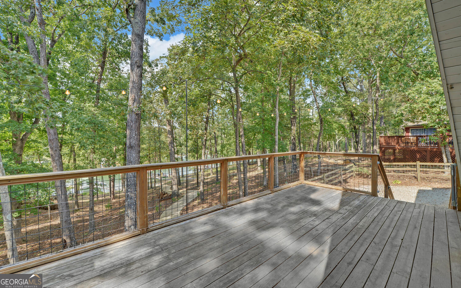 1047 Tranquility Lane Hartwell, GA 30643 - Photo 38 of 60 a view of a balcony with wooden floor and fence