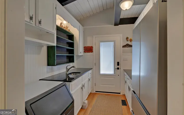 a kitchen that has a cabinets and a stove