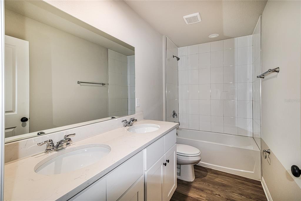 46 Ash Road Ocala, FL 34472 - Photo 18 of 20 a bathroom with a sink a toilet and shower