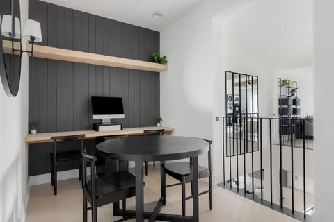 a view of a workspace with furniture