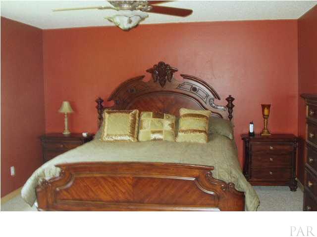 5757 Admirals Road Milton, FL 32583 - Photo 11 of 22 master bedroom,the ceiling fans in rooms are beautiful