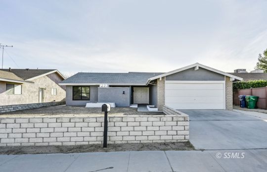 320 Dawn Court Ridgecrest, CA 93555 - Photo 2 of 24 a front view of a house with garage