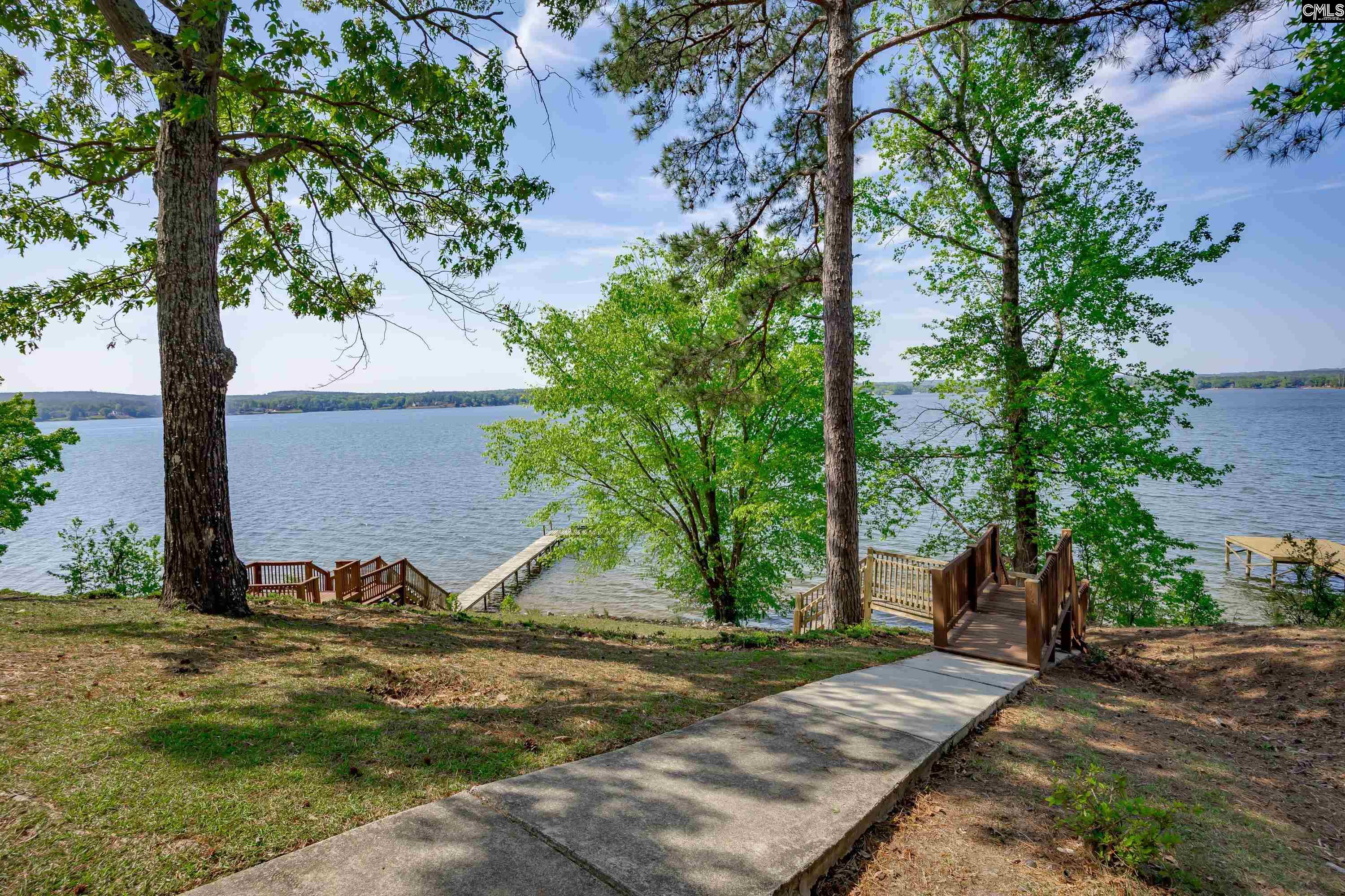 2577 Harbor View Road Camden, SC 29020 - Photo 39 of 42 a view of a tiny house with a tree and yard