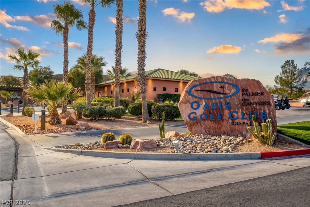 1460 Blue Ridge Trail Mesquite, NV 89027 - Photo 35 of 39 An inviting entry to the Oasis Golf Club, framed by lush desert landscaping and soaring palm trees.