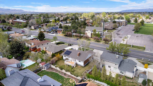 1822 East 9800th Street South Sandy, UT 84092 - Photo 11 of 38 Aerial view of residential area featuring a mountain backdrop