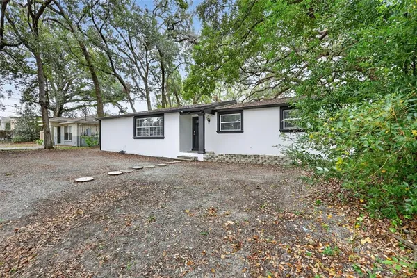 a house with trees in front of it