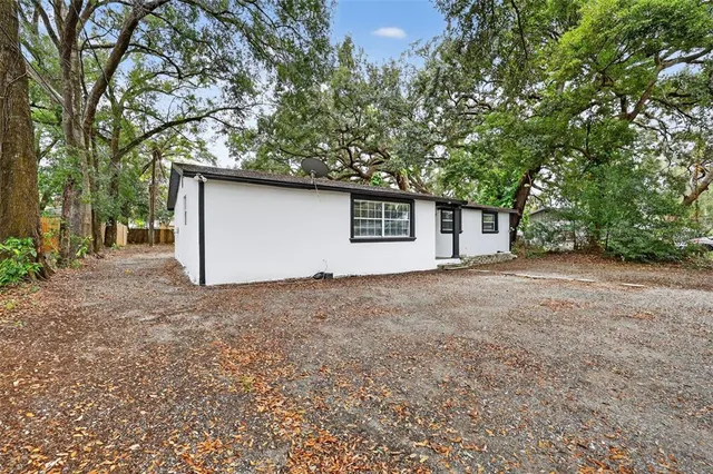 a house with trees in front of it