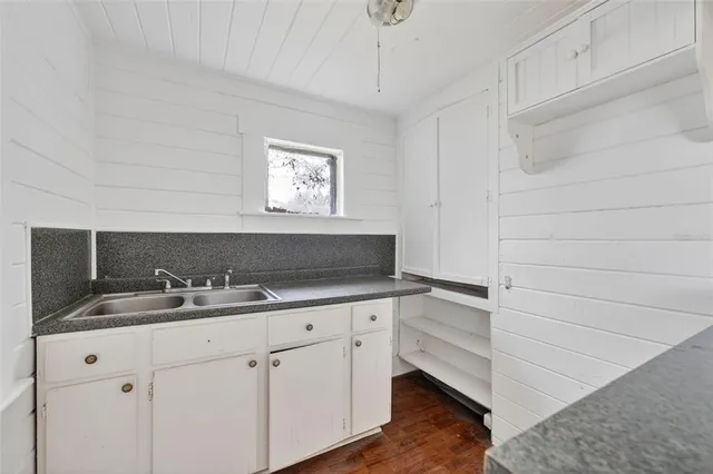 a view of cabinets a sink and dishwasher in a kitchen