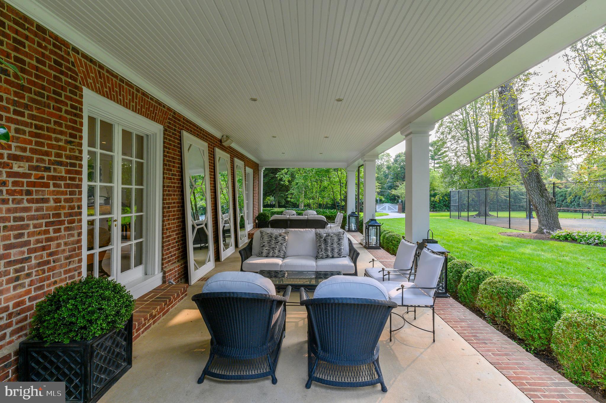 375 North Spring Mill Road Villanova, PA 19085 - Photo 66 of 72 Outside covered porch with view of tennis court