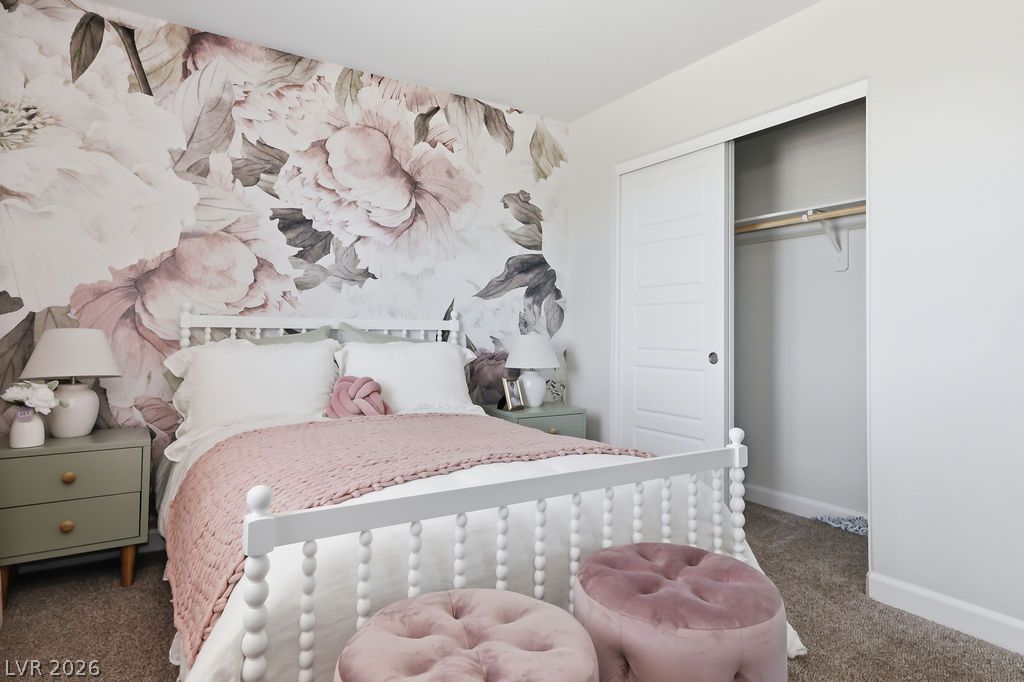 913 Cadence View Way Henderson, NV 89011 - Photo 35 of 46 A charming bedroom features a spacious closet, perfect for organizational ease.