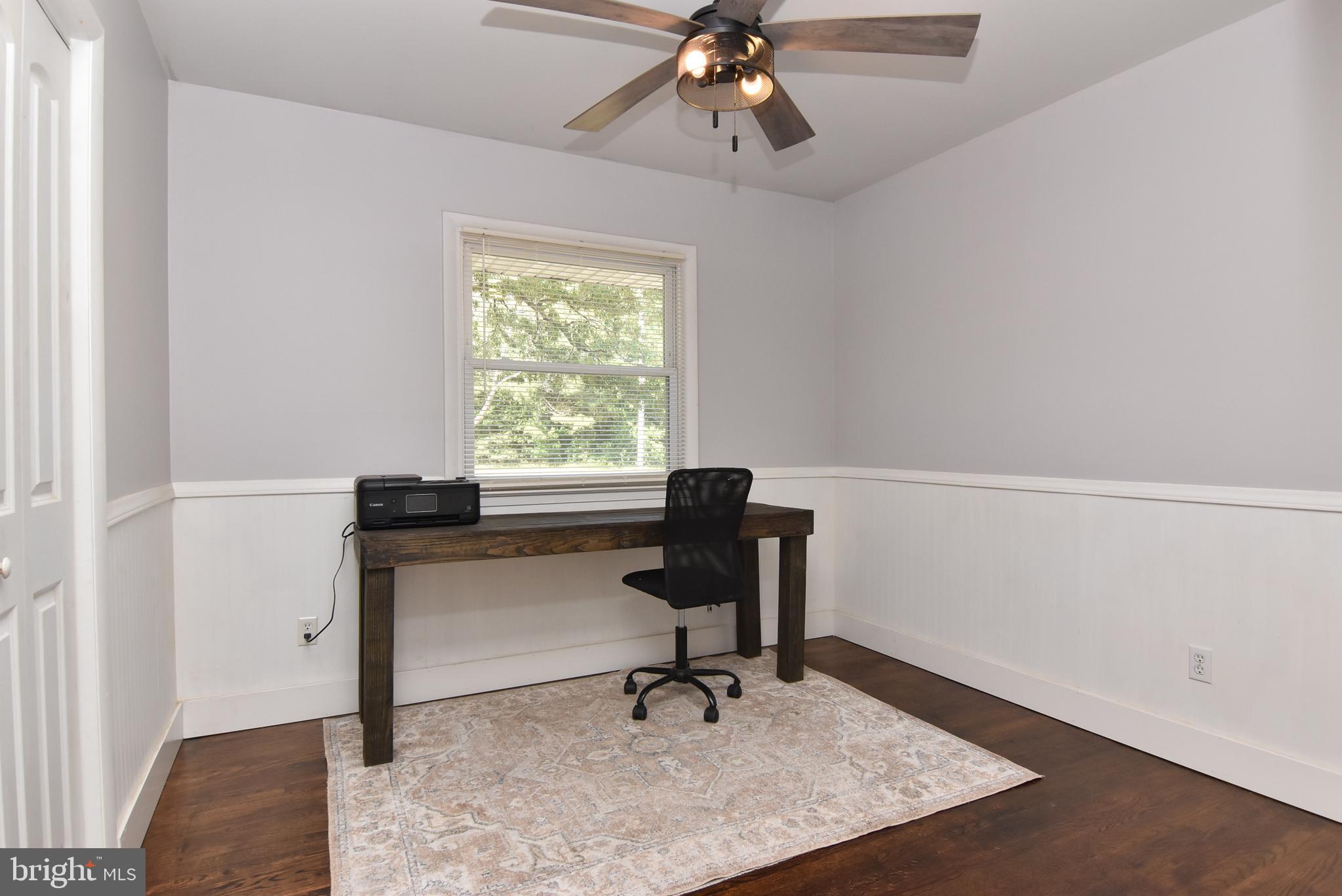 9012 Concord Road Seaford, DE 19973 - Photo 22 of 24 a view of a workspace with furniture and a window
