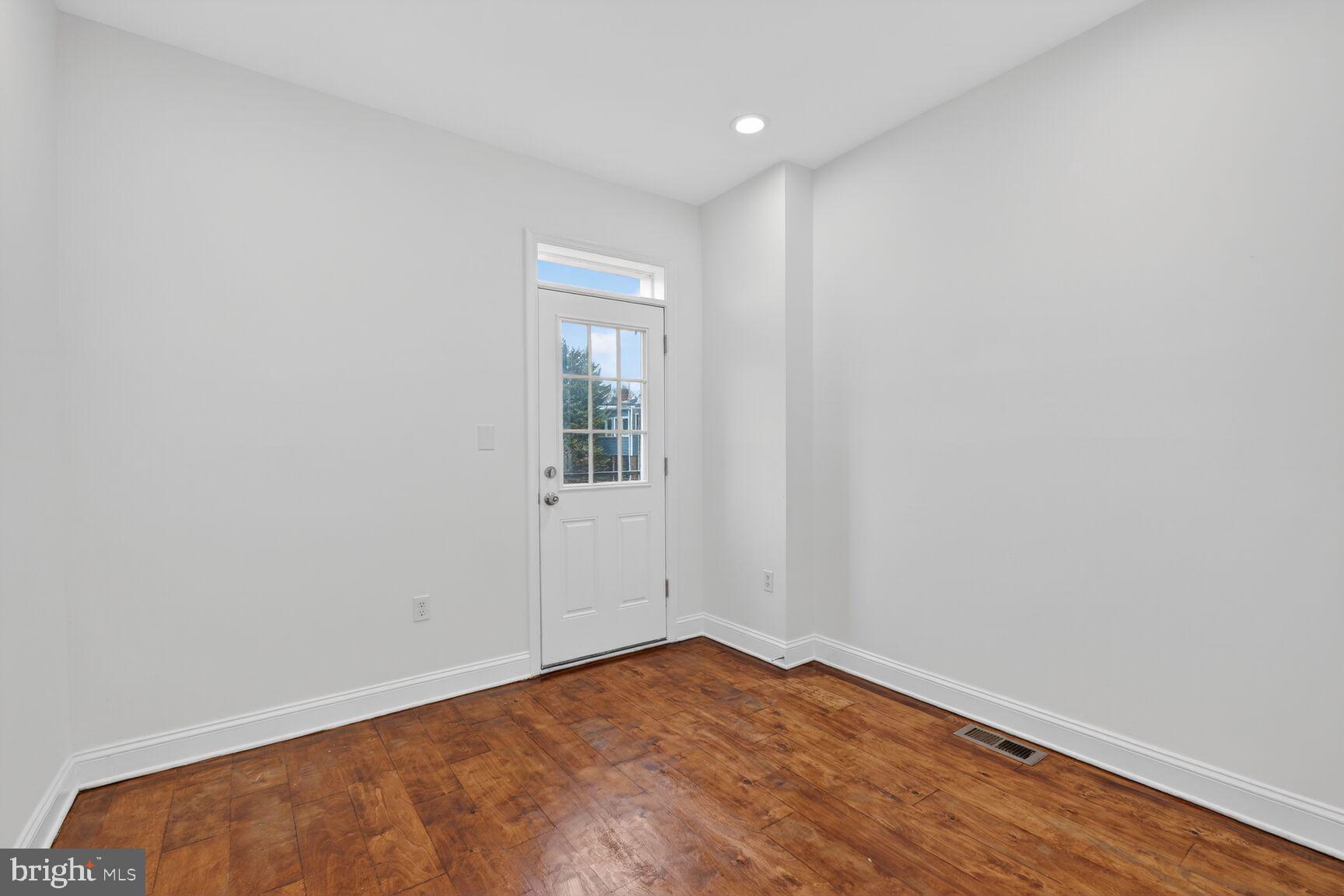 113 15th Street Southeast Washington, DC 20003 - Photo 12 of 27 a view of empty room with wooden floor and fan