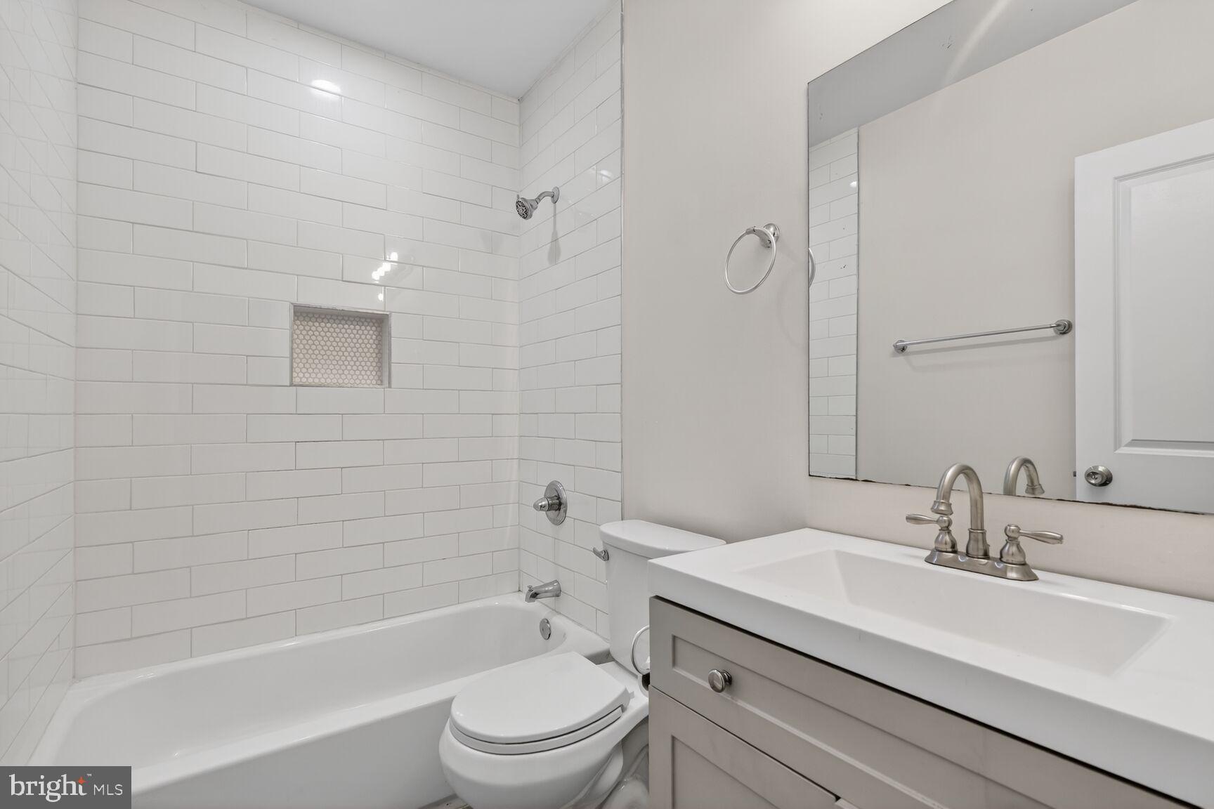 113 15th Street Southeast Washington, DC 20003 - Photo 14 of 27 a bathroom with a sink a toilet and shower