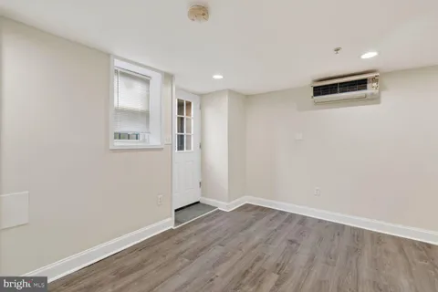a kitchen with granite countertop a sink and a stove top oven