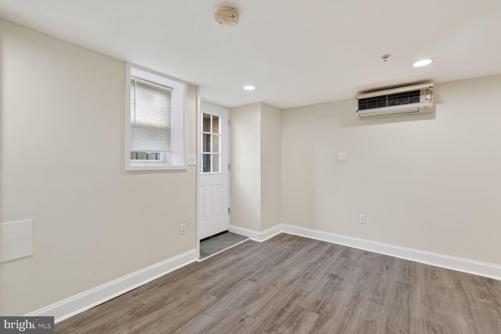 113 15th Street Southeast Washington, DC 20003 - Photo 16 of 27 an empty room with wooden floor and windows