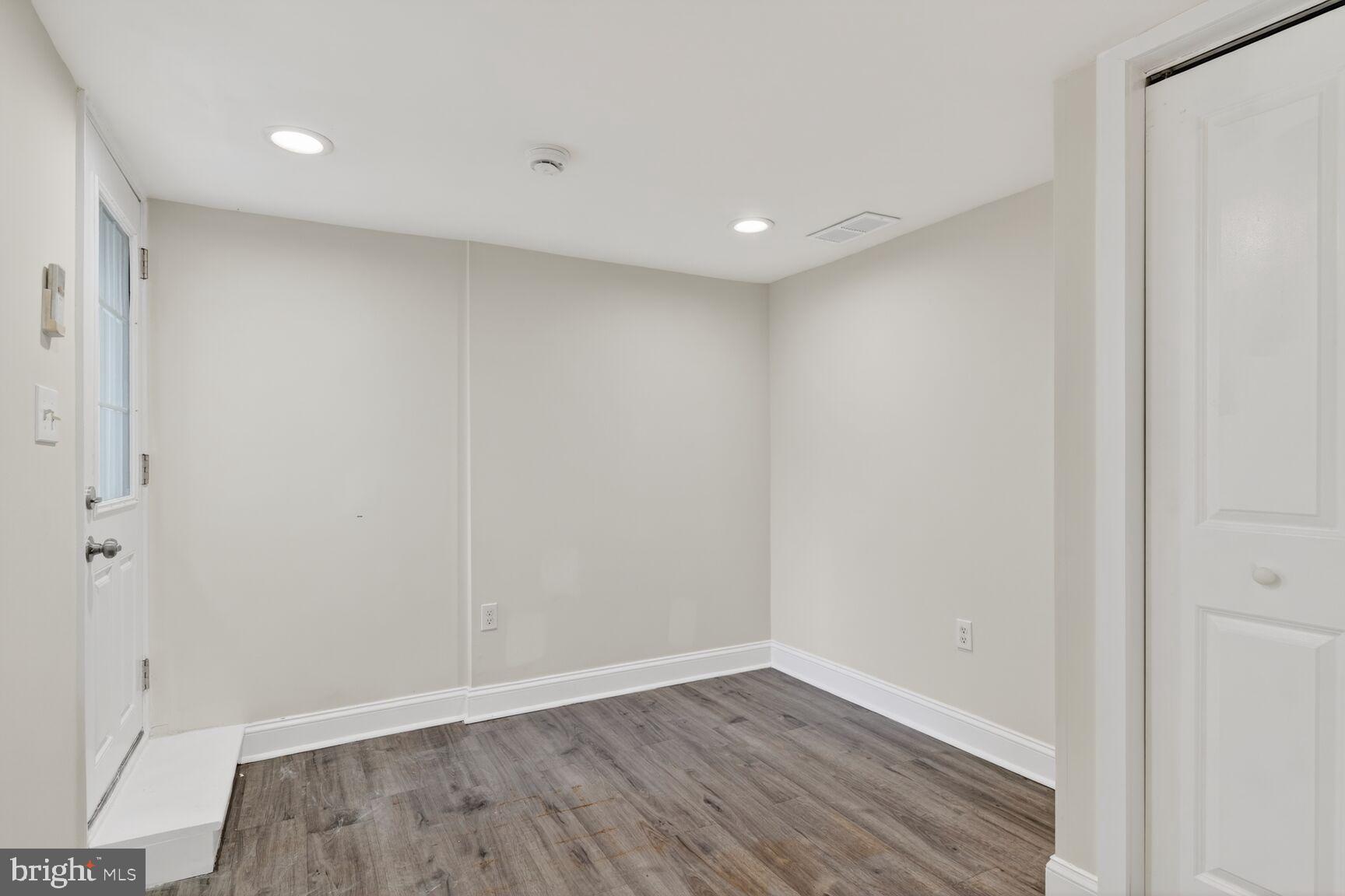 113 15th Street Southeast Washington, DC 20003 - Photo 22 of 27 a view of an empty room with wooden floor