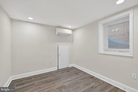 front view of a brick house with many windows