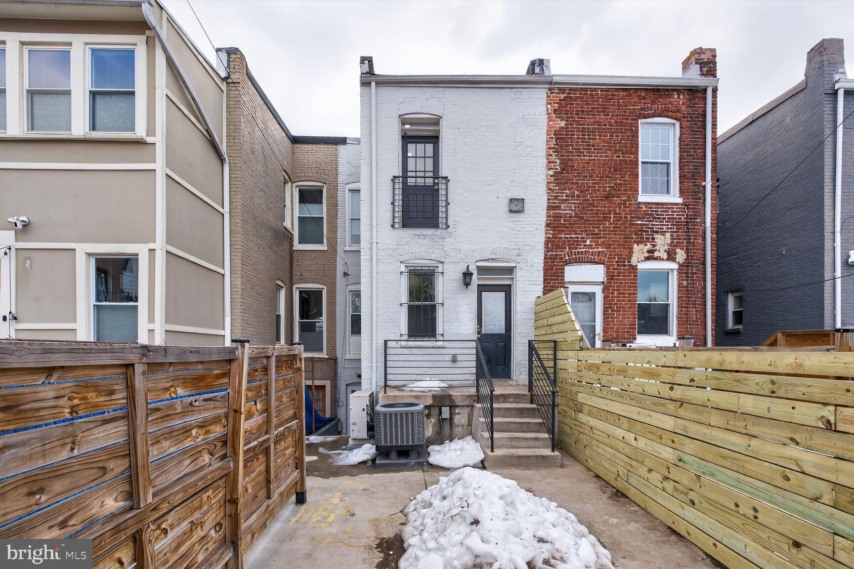 113 15th Street Southeast Washington, DC 20003 - Photo 24 of 27 front view of a brick house with many windows