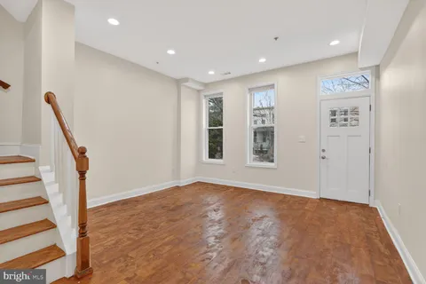 a kitchen with stainless steel appliances granite countertop a sink stove and microwave