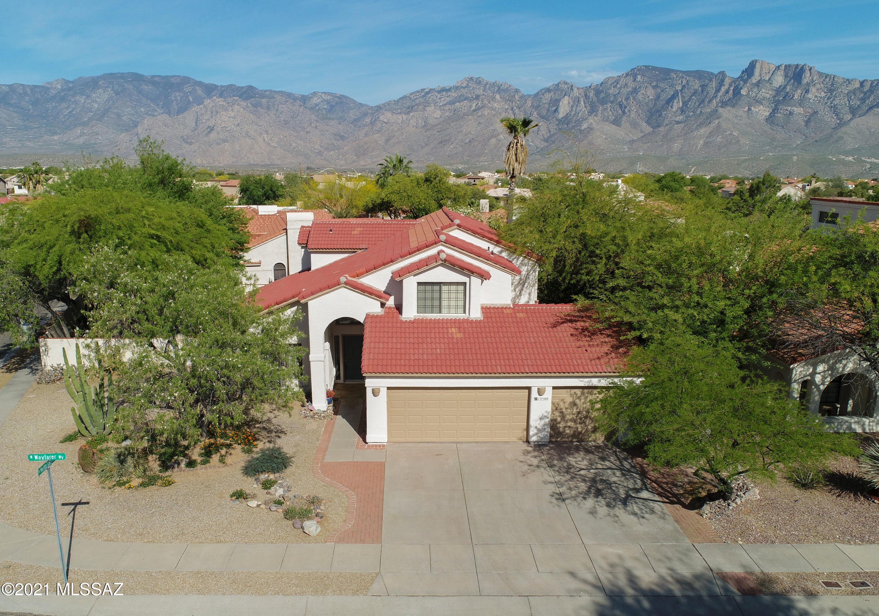 12560 North Wayfarer Way Oro Valley, AZ 85755 - Photo 1 of 43 an aerial view of houses with trees