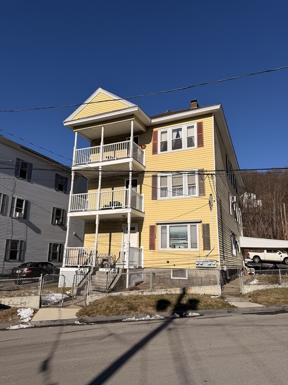 1 Verdi Road Worcester, MA 01604 - Photo 1 of 11 a front view of a building with street