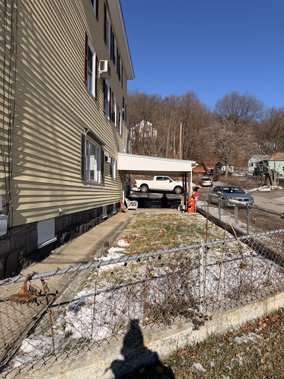 1 Verdi Road Worcester, MA 01604 - Photo 4 of 11 a yellow house with trees in front of it