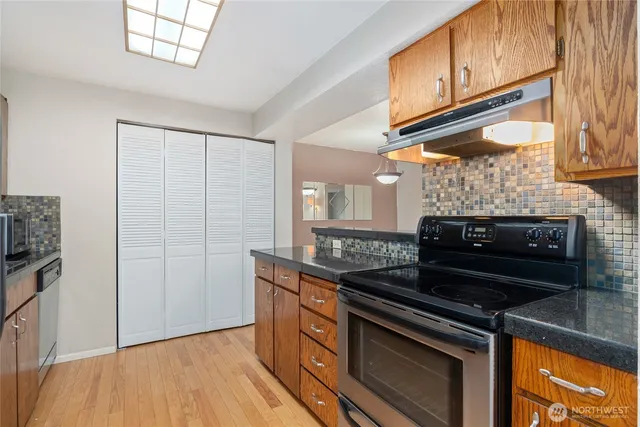 a kitchen with a stove and a microwave