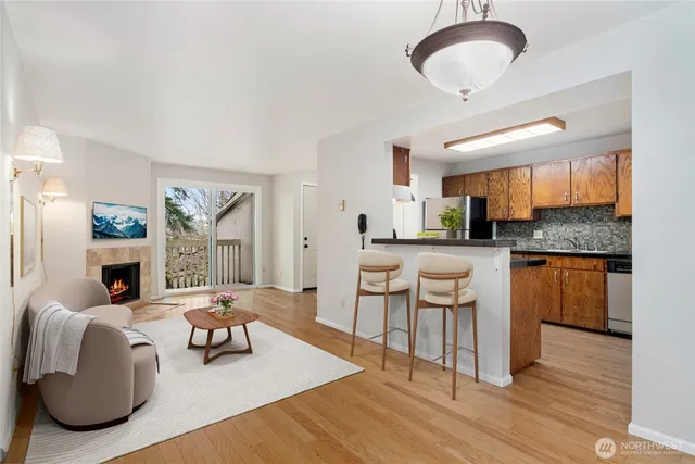 a living room with granite countertop kitchen island furniture and a chandelier