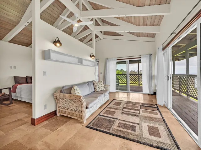 a spacious bedroom with a bed and a window